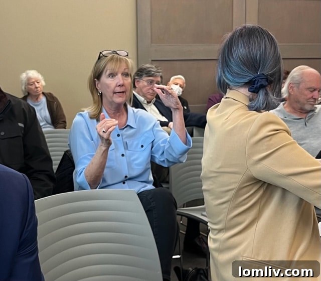 Kathy Stewart speaking at a town hall meeting about Cypress Creek at Forest Lane development