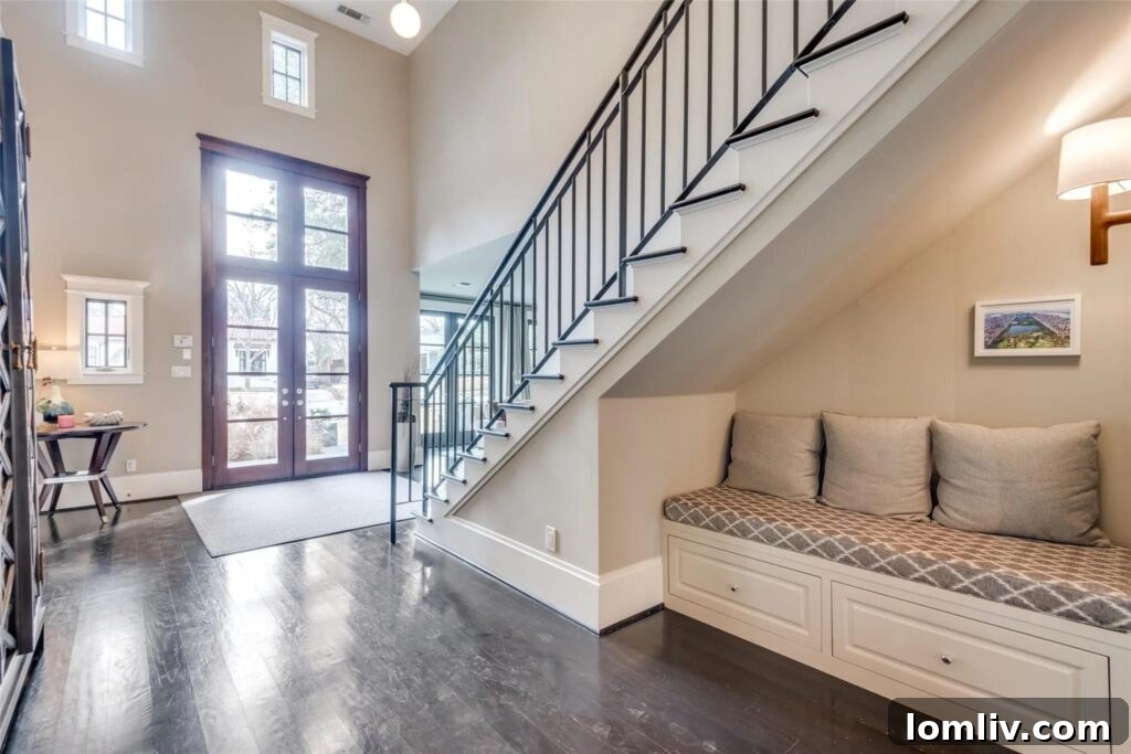 Elegant dining room featuring dual full-size wine refrigerators, sleek design, and access to an outdoor courtyard