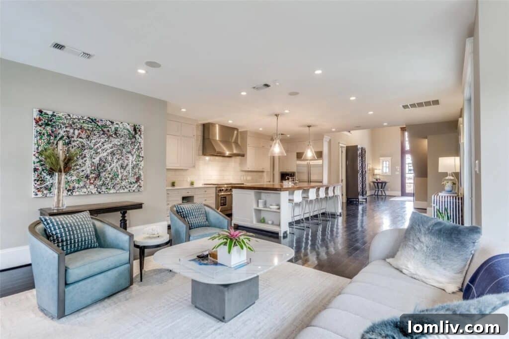Cozy yet elegant den area featuring a fireplace, comfortable seating, and access to the outdoor patio
