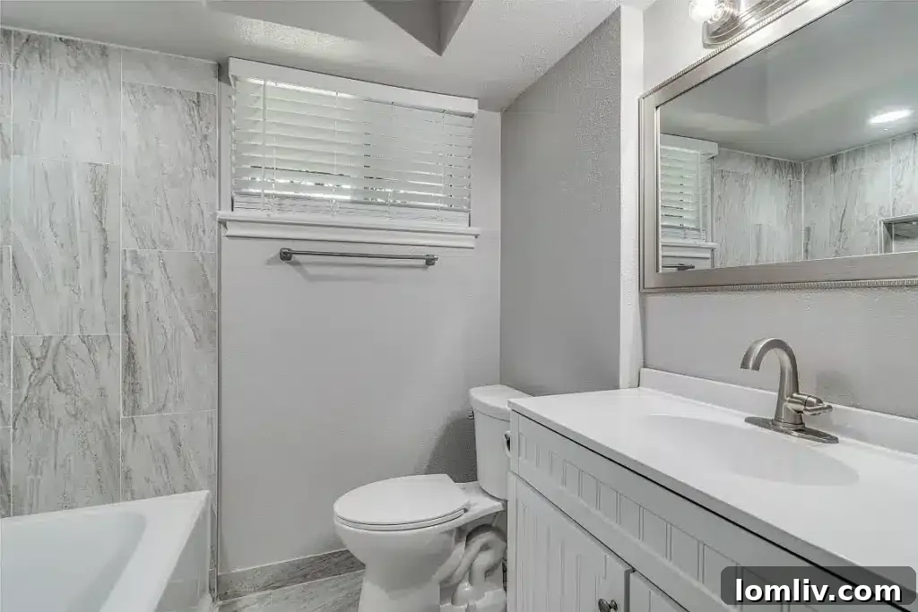 Elegant primary bathroom with modern vanity and fixtures