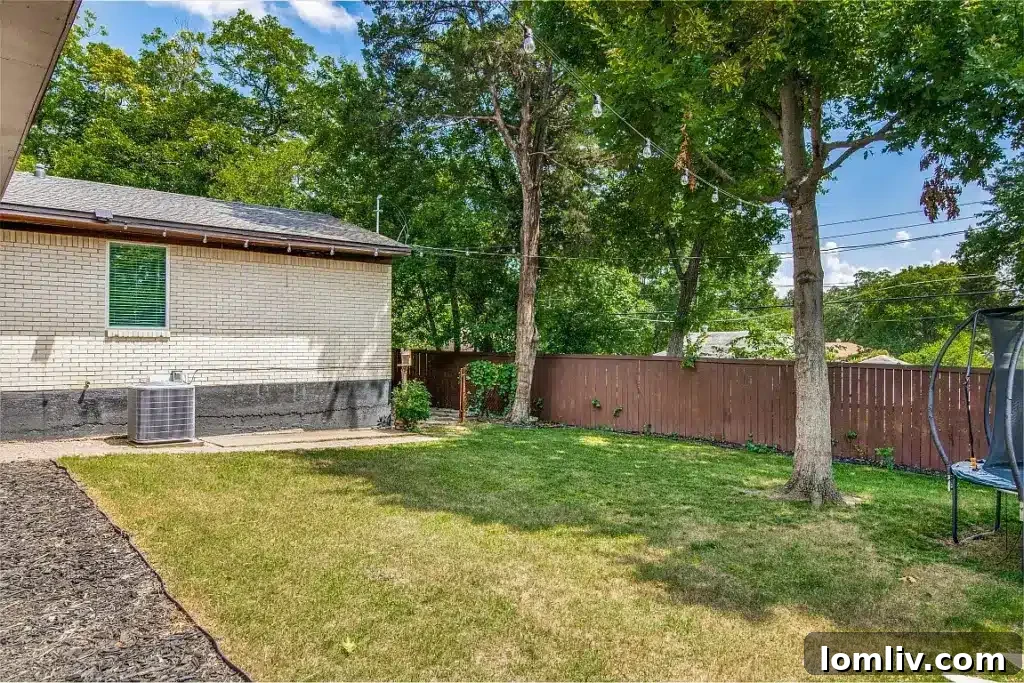 Peaceful backyard with mature trees, ideal for relaxation and outdoor living