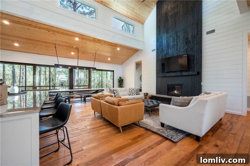 Luxurious master bathroom in a Broken Bow cabin, featuring a large freestanding tub, dual vanities, and modern fixtures for a spa-like experience