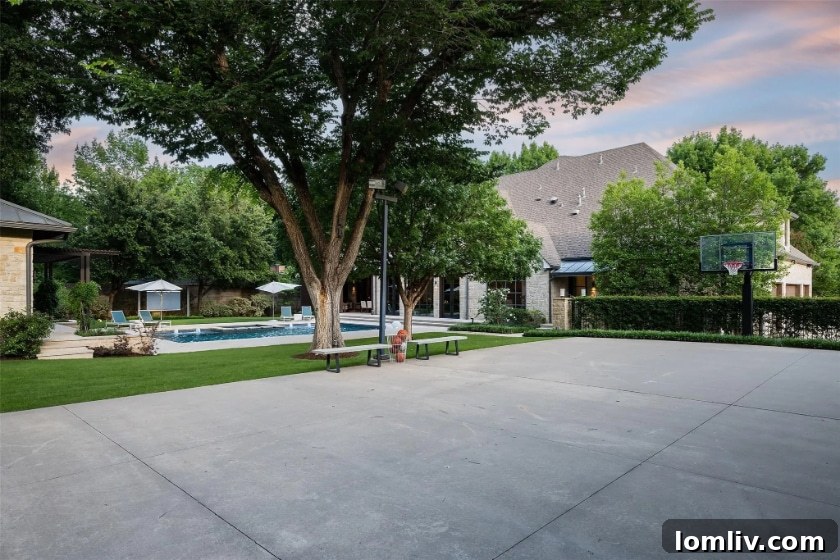 Preston Hollow's Transitional Pool Masterpiece 13 Inviting spa area adjacent to the custom pool, perfect for relaxation