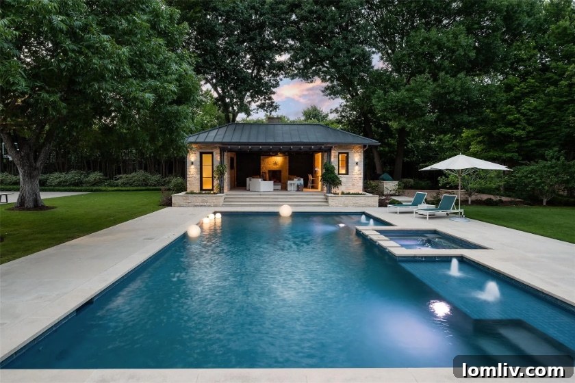 Preston Hollow's Transitional Pool Masterpiece 15 Vast green lawn and meticulously landscaped backyard of the Preston Hollow estate