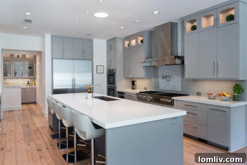 Preston Hollow's Transitional Pool Masterpiece 7 Modern kitchen with large island and high-end appliances