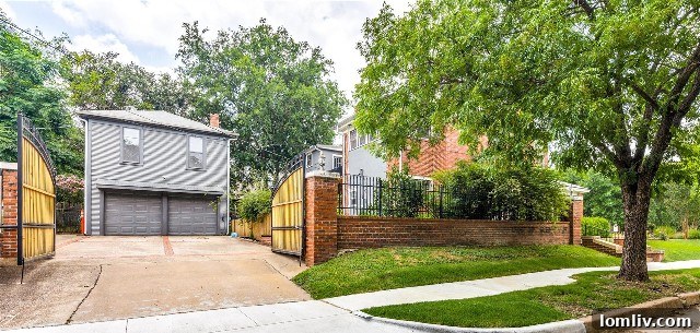 Gated entrance to the detached garage apartment