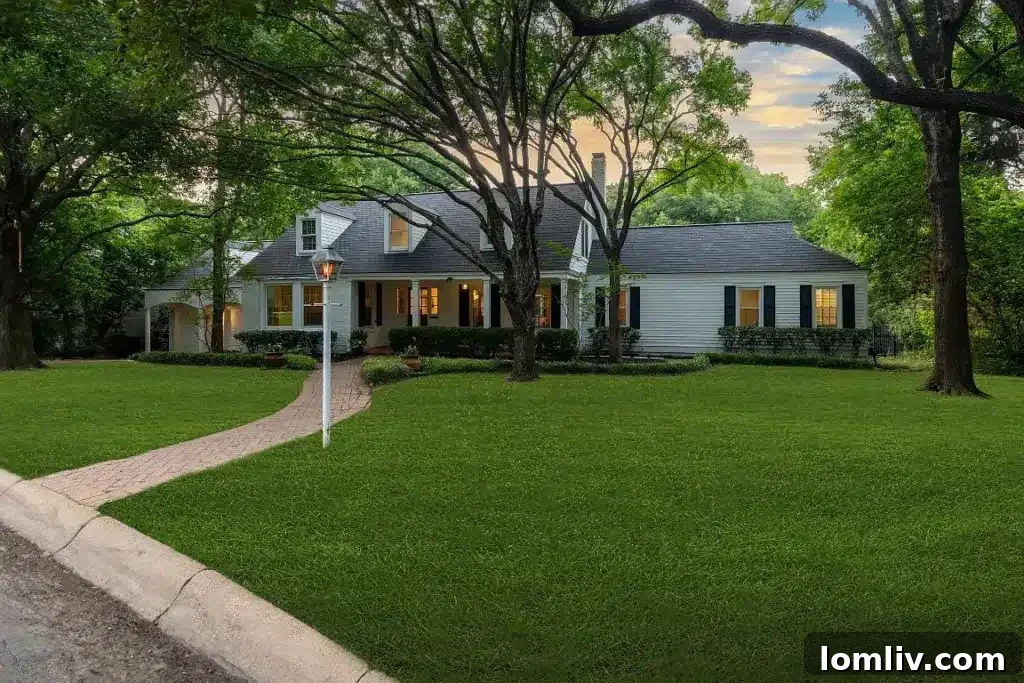 White exterior of a meticulously maintained classic home with a grand appeal on a hillside.