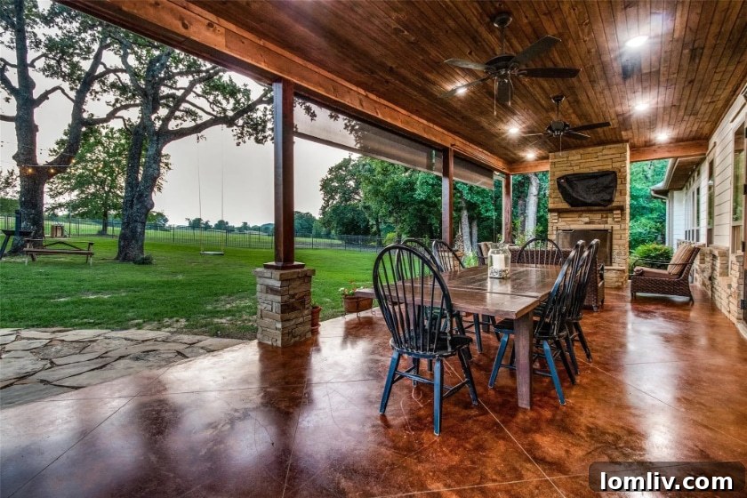 Luxurious outdoor patio with seating and fans
