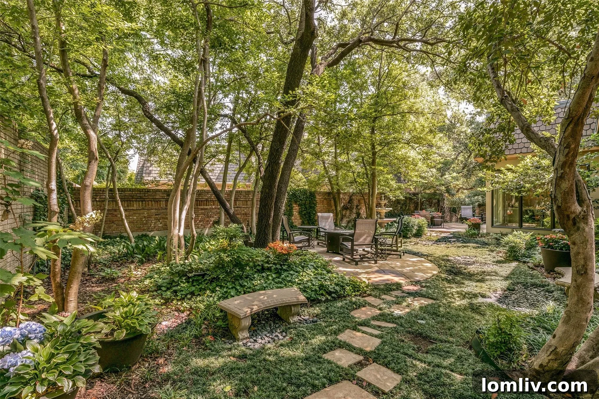 Lush exterior landscaping creating a park-like backyard setting