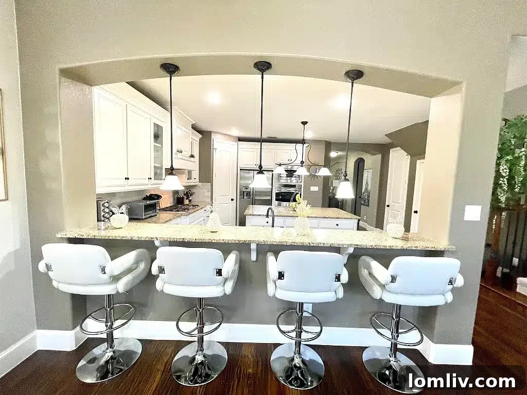 Kitchen pass-through view to living room and fireplace