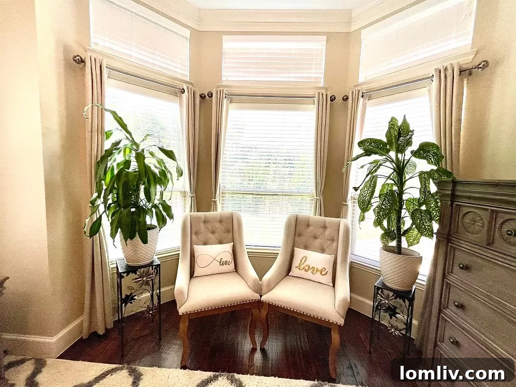Primary bedroom featuring a light-filled sitting area for relaxation