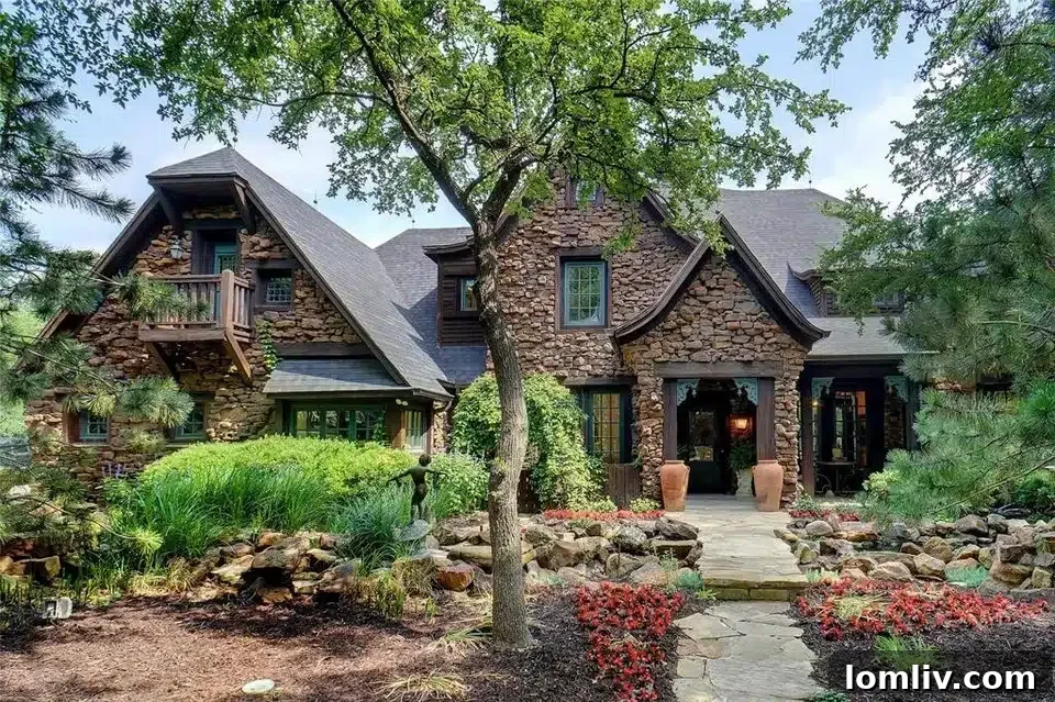 Expansive custom home with stone facade and lush landscaping