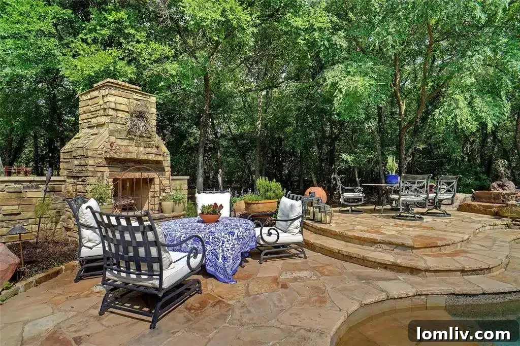Expansive outdoor covered kitchen with Viking grill and ceiling fans