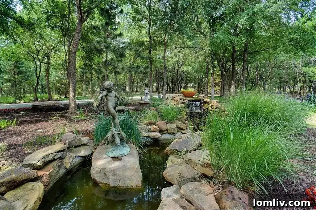 Private gate and circular drive leading to the custom stone home