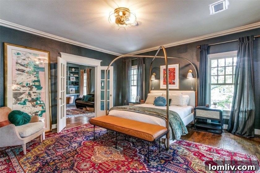 Luxurious master bedroom with abundant natural light in the Oak Lawn residence