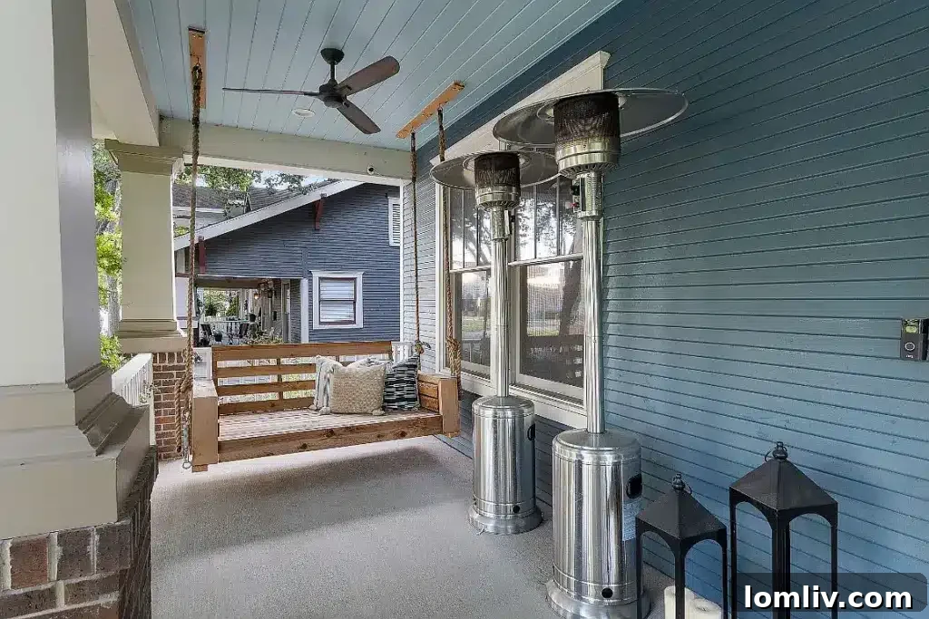 Front view of the 4601 Worth Street Craftsman home with a wide covered porch and columns