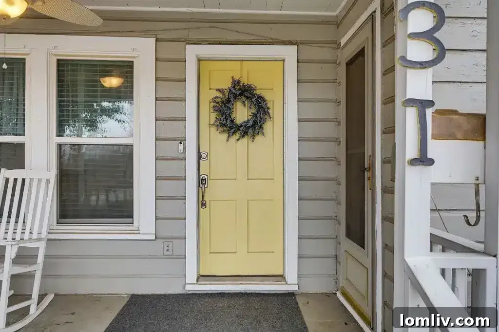 Inviting covered front porch with rocking chairs at 131 Milton Street