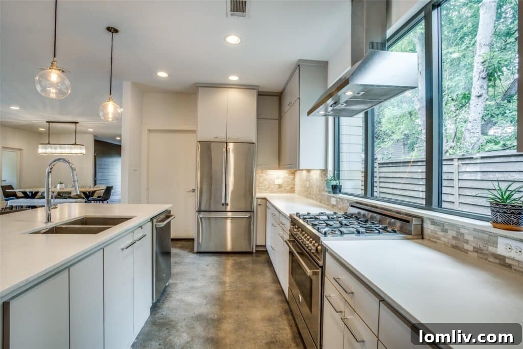 Cool Down: Your Next Home Awaits 13 A modern and elegant kitchen in 3938 Lively Lane, featuring high-quality finishes, integrated appliances, and a spacious island for cooking and gathering.