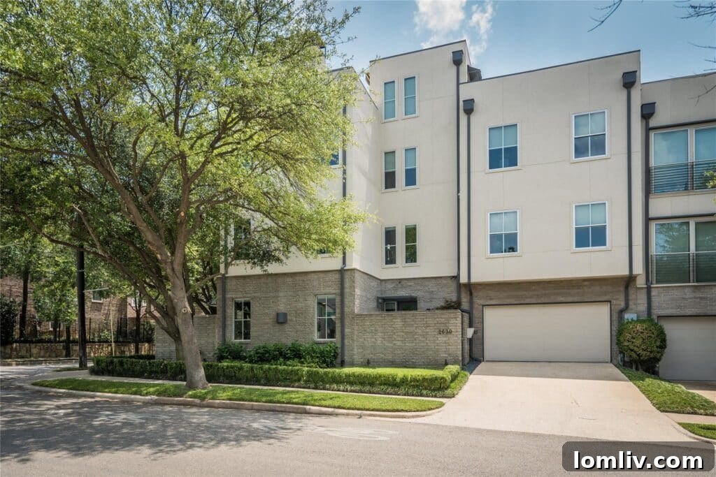 Cool Down: Your Next Home Awaits 8 The impressive rooftop deck of 2630 Welborn Street, featuring an outdoor kitchen, fireplace, and stunning city views, ideal for entertaining.