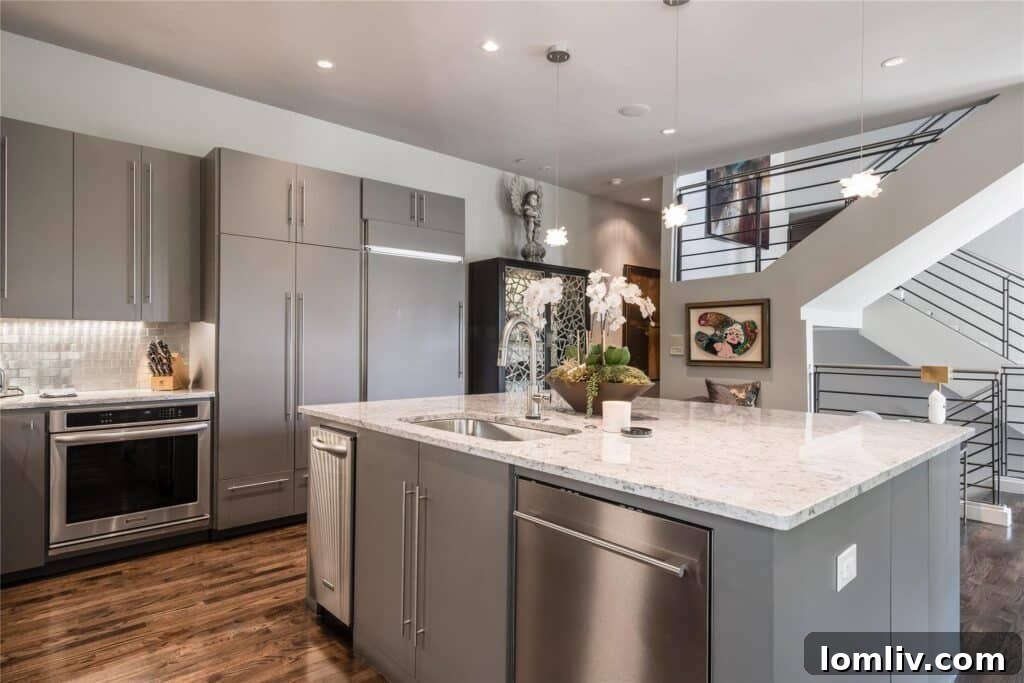 Cool Down: Your Next Home Awaits 10 A stylish kitchen and dining area in 2630 Welborn Street, featuring sleek design and ample space for culinary activities and entertaining.