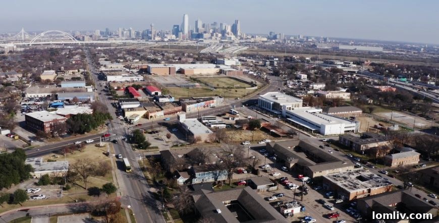 Overhead view of a highway with surrounding urban development