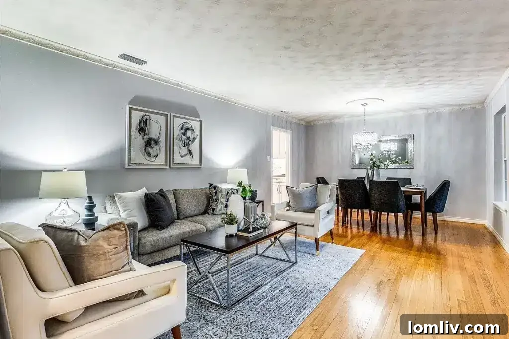 Bright formal sitting room with large windows and elegant decor, flowing into dining area