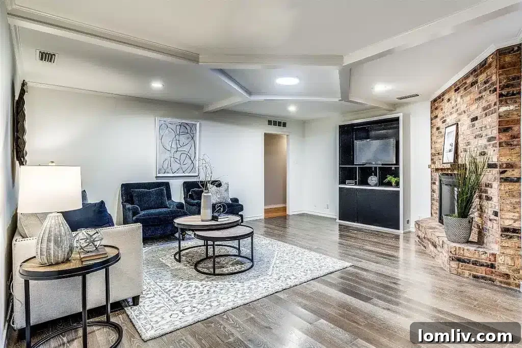 Spacious open-concept formal dining area with a modern chandelier and access to other living spaces