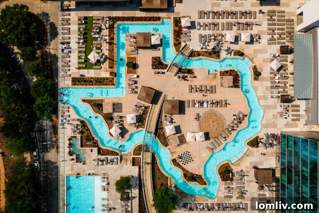 Aerial shot of the Texas-shaped lazy river at the Marriott Marquis Houston, surrounded by city skyscrapers.