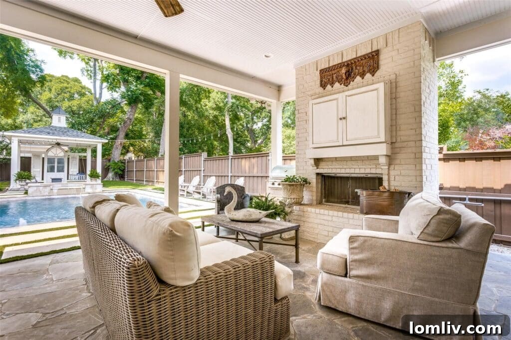 Expansive covered patio with outdoor kitchen and fireplace