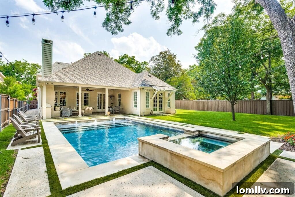 Aerial view of the stunning backyard with pool and ample green space