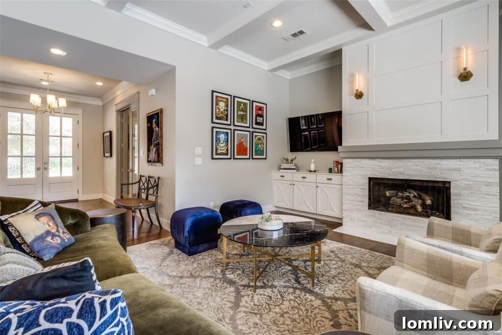 Open-concept kitchen and living room with fireplace and island seating