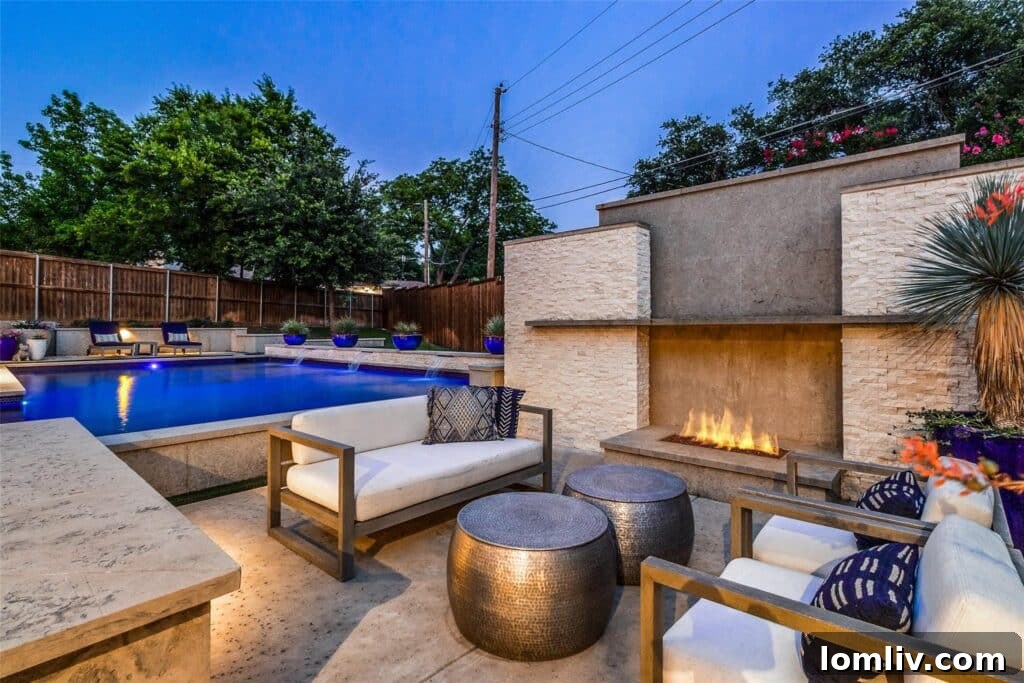 Luxurious backyard with sunken seating area, fireplace, and pool