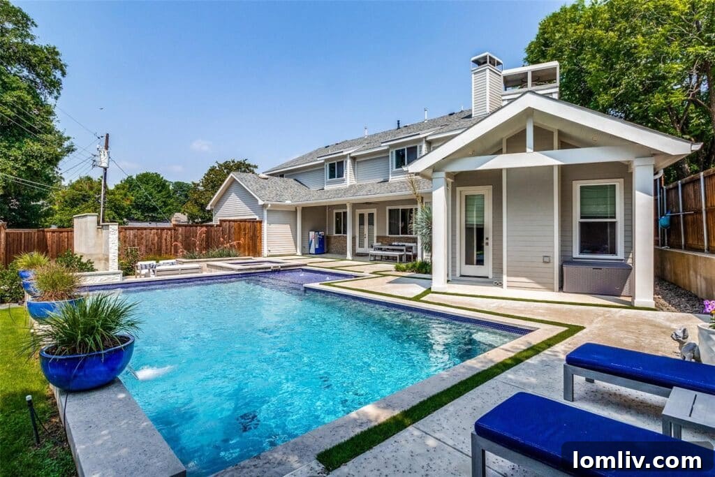 View of the expansive backyard with pool and entertainment areas