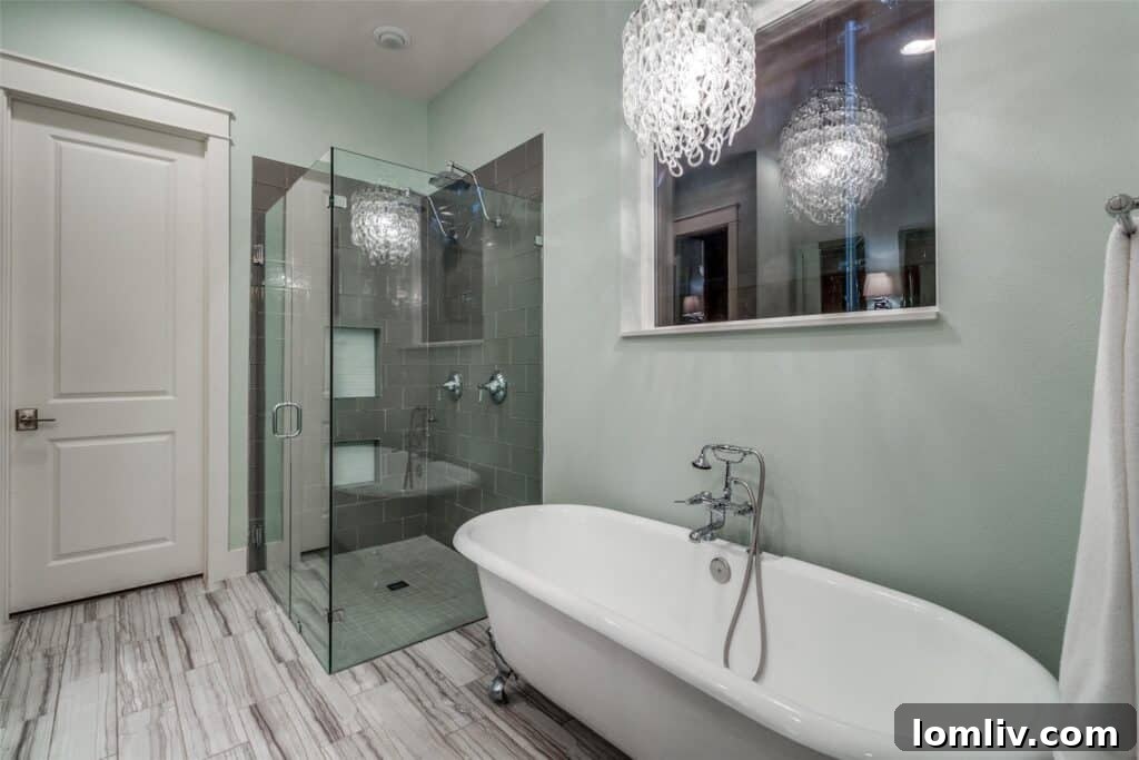 Luxurious primary bathroom with double vanity and soaking tub