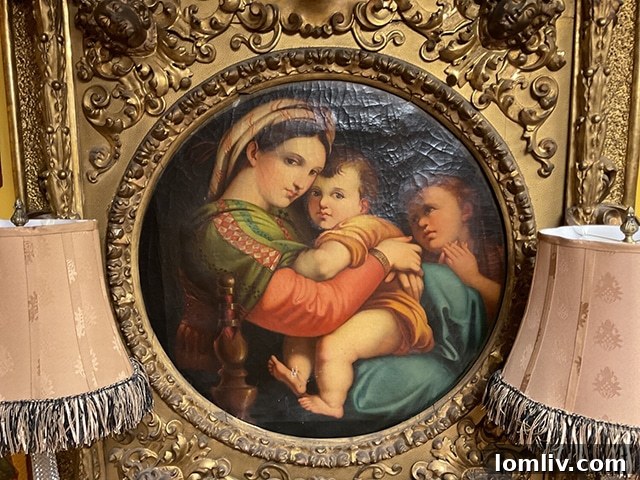 A painting of Madonna and Child, an antique piece, displayed in M.D. Antiques