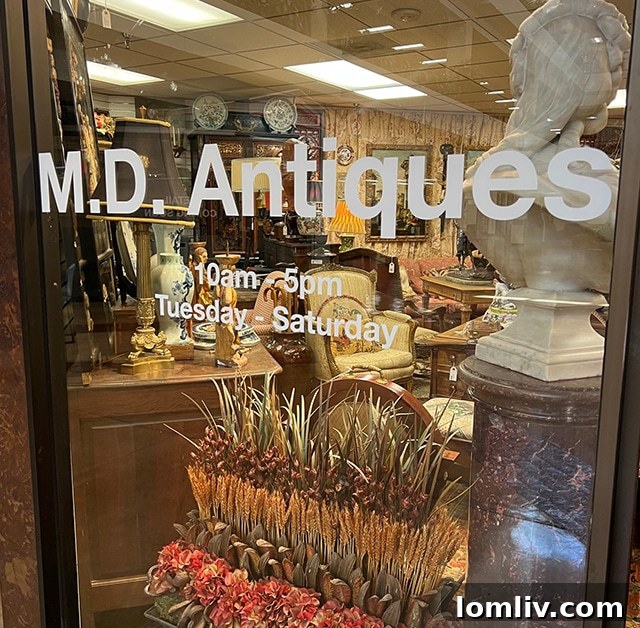 A wide shot inside M.D. Antiques, showcasing a diverse array of antique furniture and decorative items