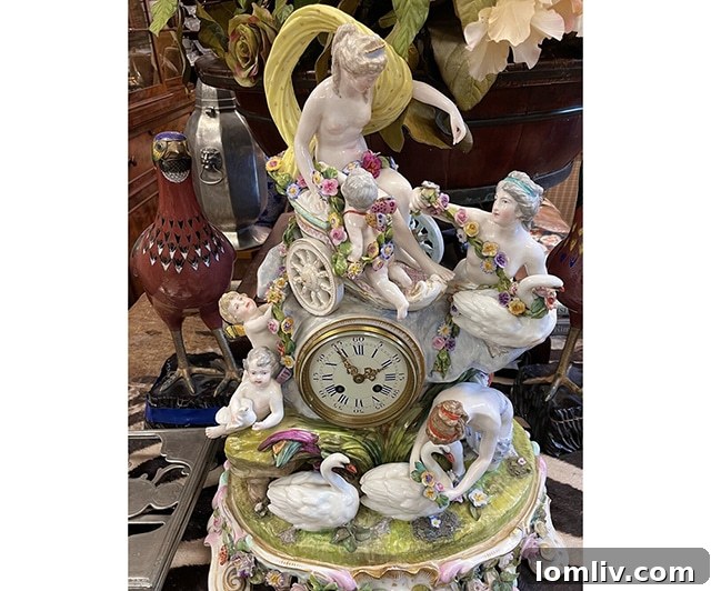 A stunning Meissen porcelain figural mantel clock next to a classical marble bust, both prominently displayed at M.D. Antiques