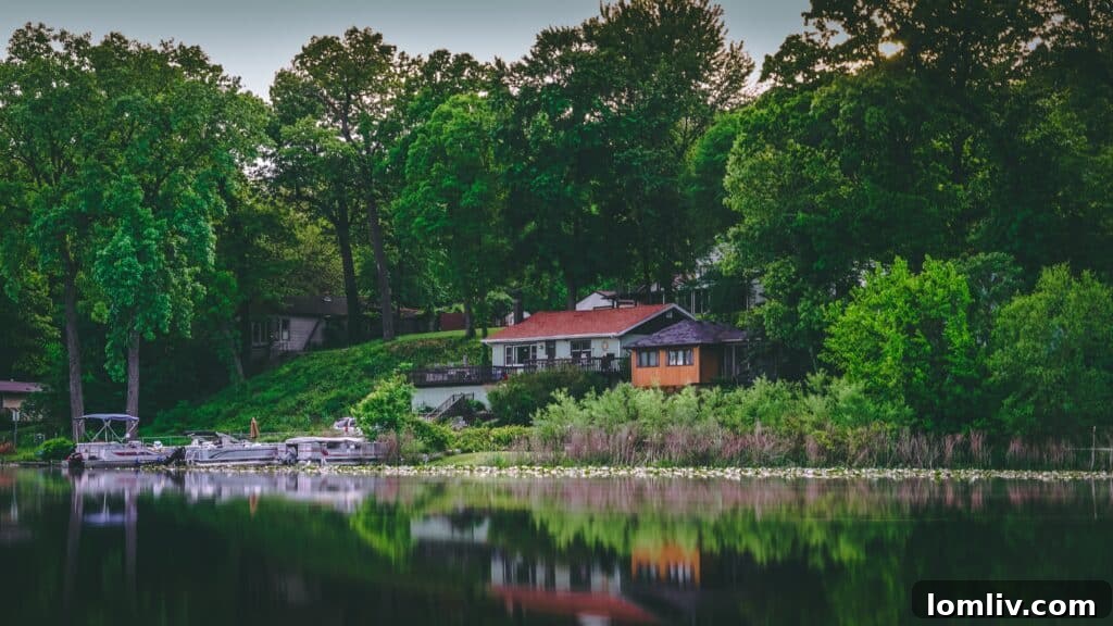 Renting Out Your Vacation Home: What You Must Know First 2 A serene lake house with a deck overlooking calm water, symbolizing a second home ideal for vacation rentals.