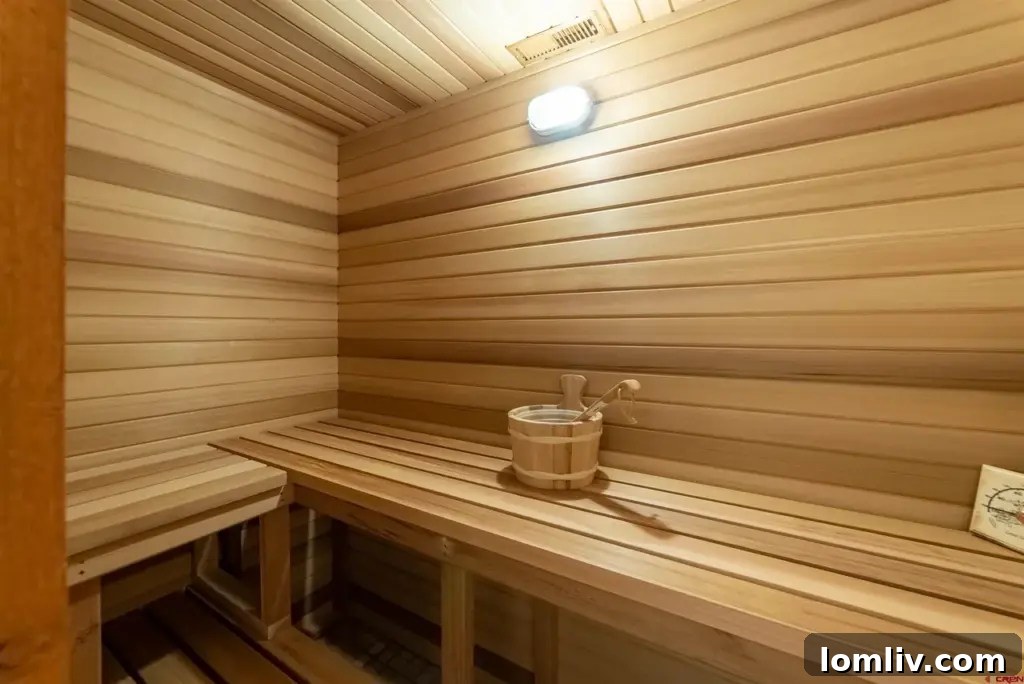 Luxurious primary bathroom with double vanity and elegant finishes.