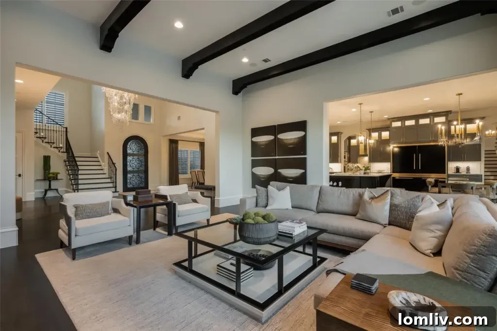 Cozy family room featuring a petrified wood accent wall surrounding a fireplace, large windows, and comfortable seating.