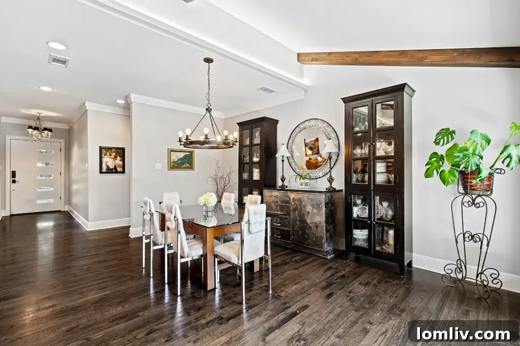 Spacious living area with natural light and hardwood floors