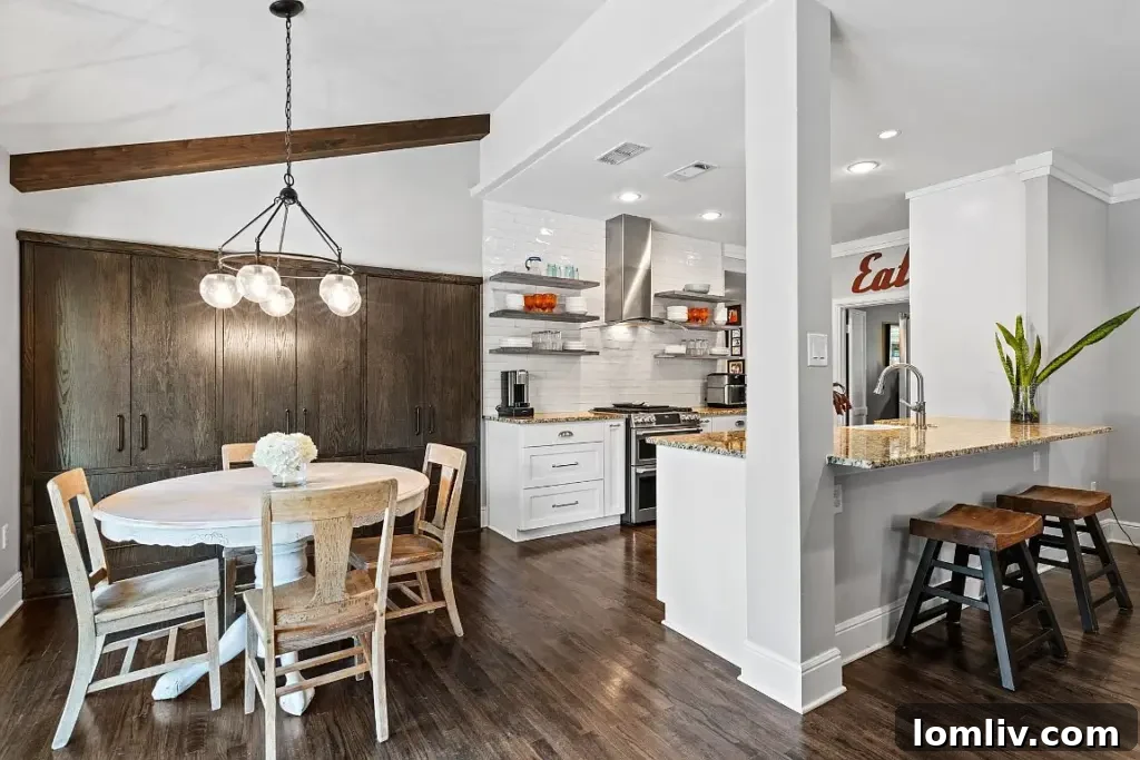 Another perspective of the open-concept living and dining space