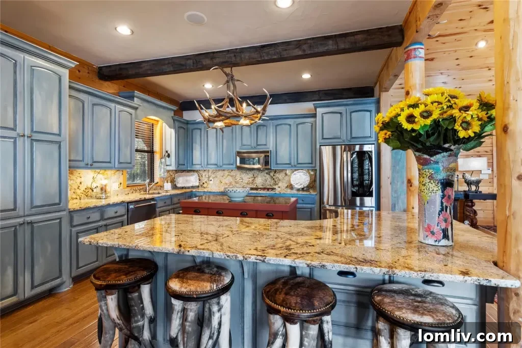 Spacious open-concept kitchen and dining area in Frogs Lakehouse with granite countertops, high-end appliances, and stunning lake views.