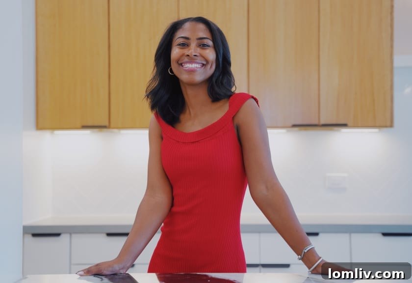 Loren Hall smiling while engaging with a book
