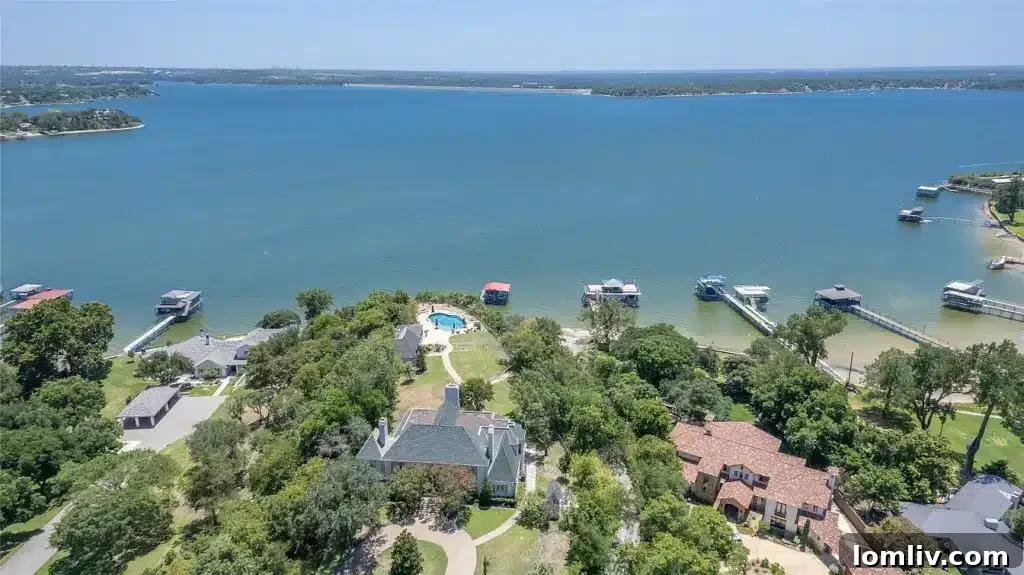 Aerial view of Eagle Mountain Lake, showcasing its vast waters and surrounding green landscape under a clear sky, highlighting a tranquil oasis near Fort Worth.