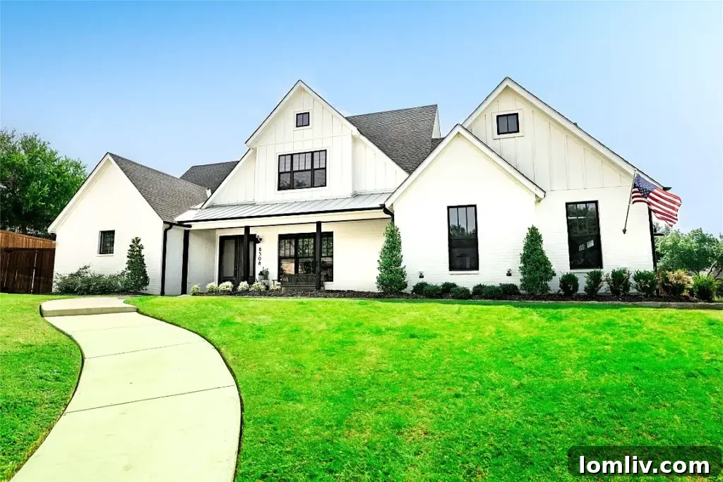 Striking new construction home at 8508 Woodlake Circle with a modern facade, expansive windows, and sophisticated curb appeal near Eagle Mountain Lake.