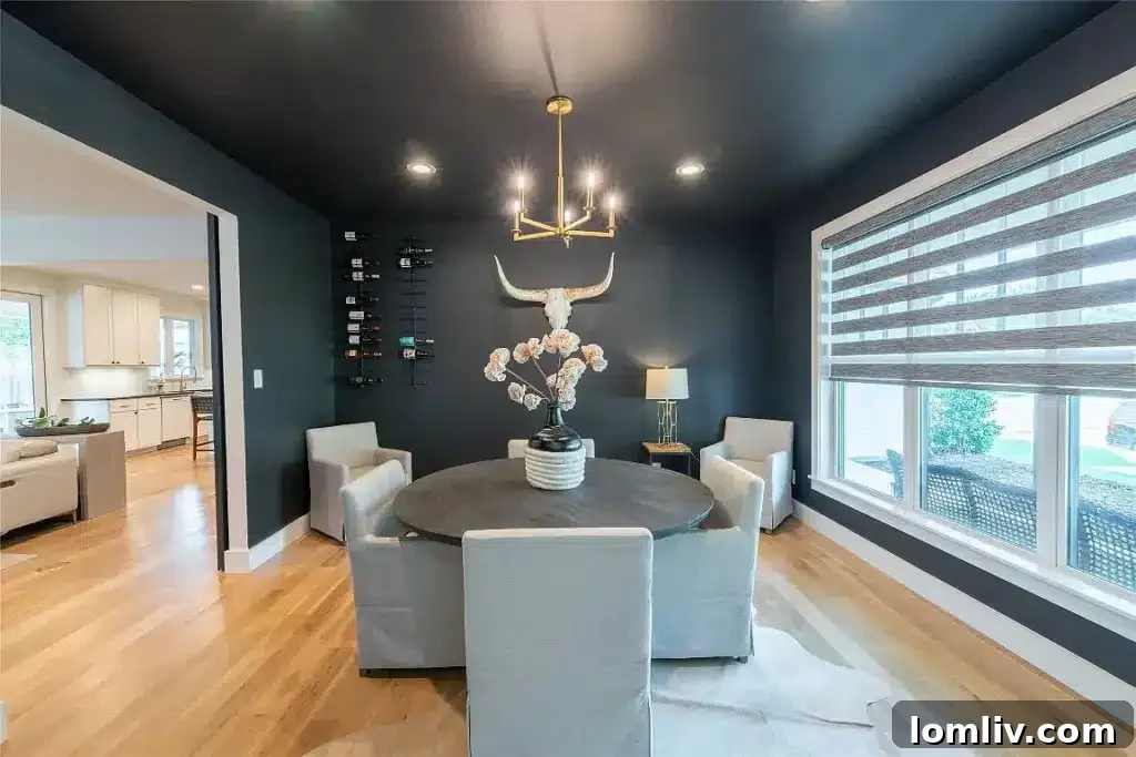 Spacious open-concept living area with soaring ceilings and large windows, offering abundant natural light and a contemporary feel.