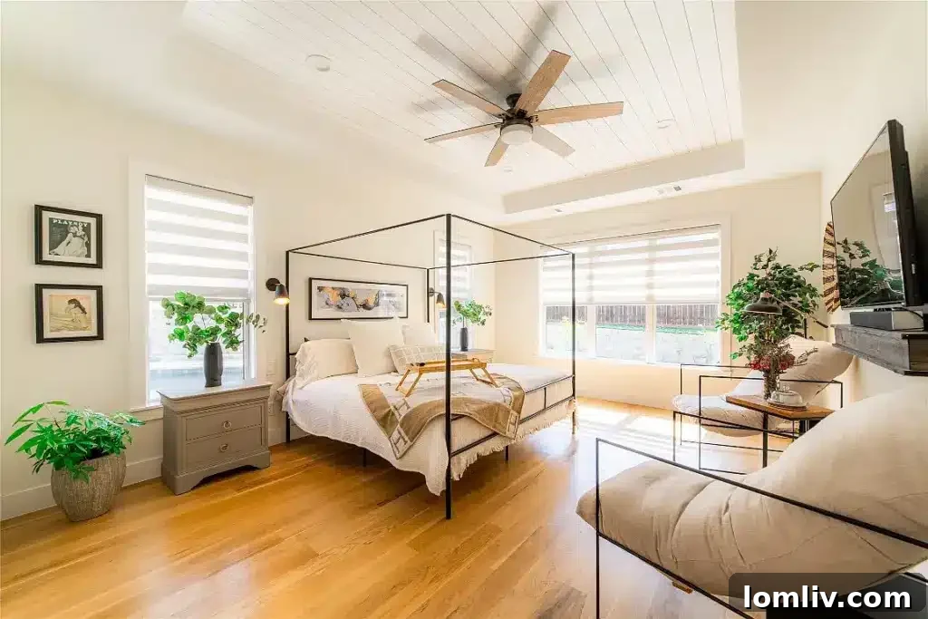 Luxurious primary bedroom suite with a serene ambiance, ample space, and direct access to a private balcony.