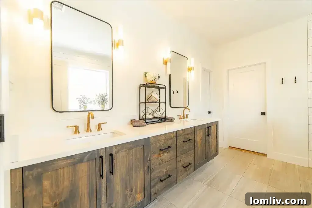Modern bathroom with double vanity, sleek tiling, and a large walk-in shower, exemplifying contemporary design.