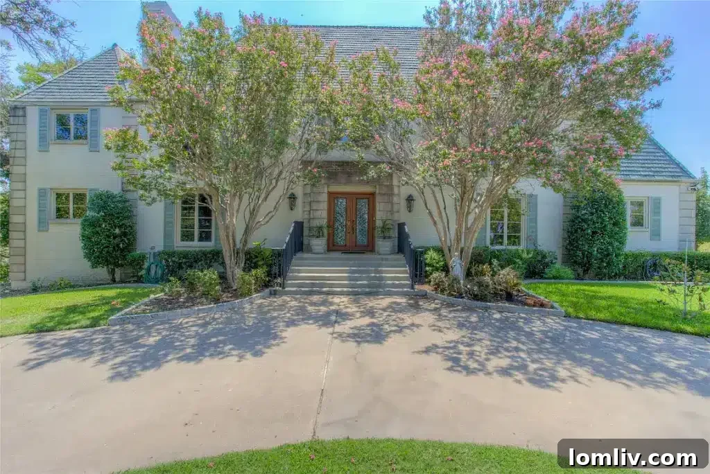 Luxurious aerial view of a grand estate on Boat Club Road, featuring expansive grounds, multiple structures, and direct, panoramic views of Eagle Mountain Lake.